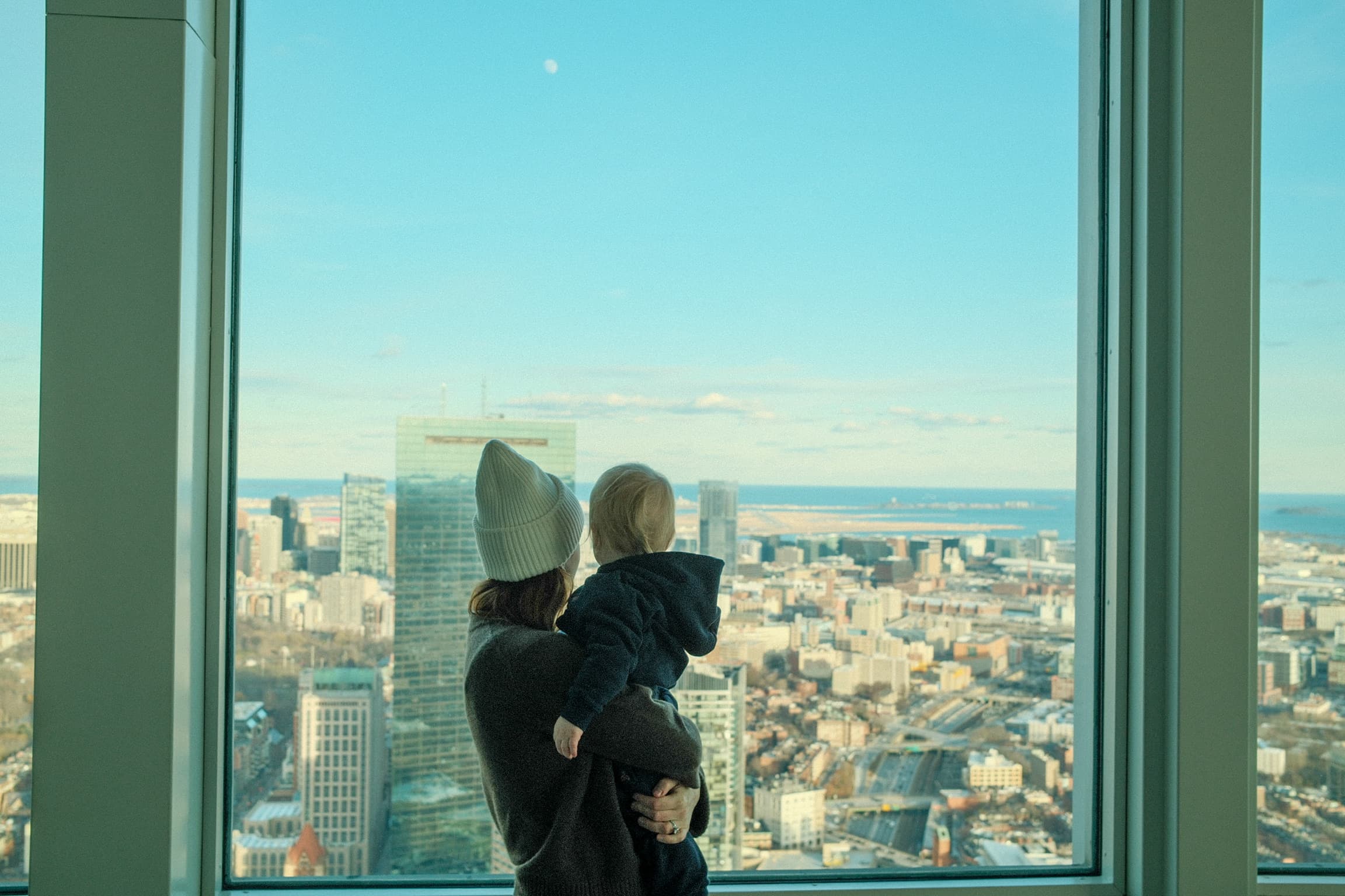 Caroline and son overlooking Boston skyline